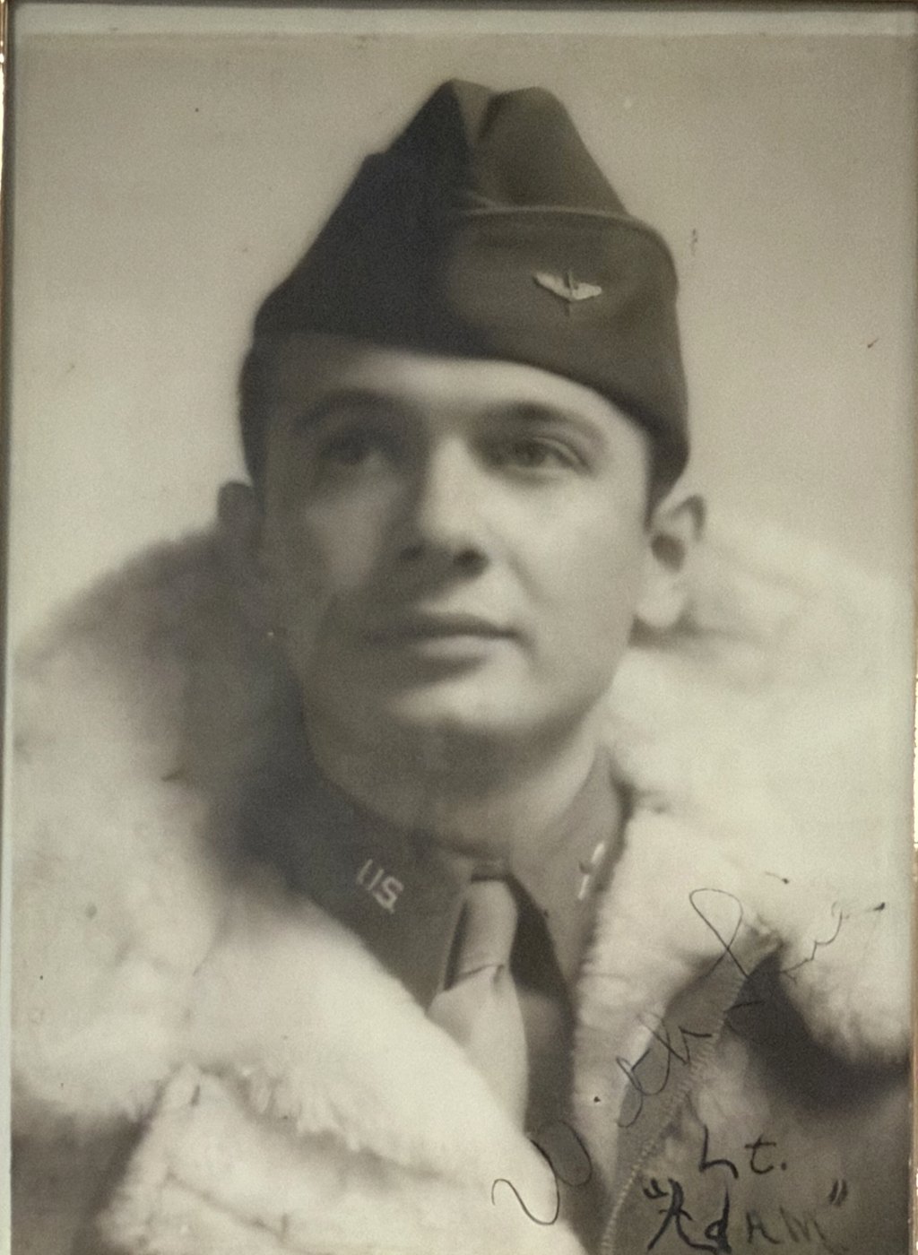 Portrait of Adam Pyzyna in an Army Air Forces cap and sheepskin flying jacket, signed &ldquo;Lt. Adam&rdquo;