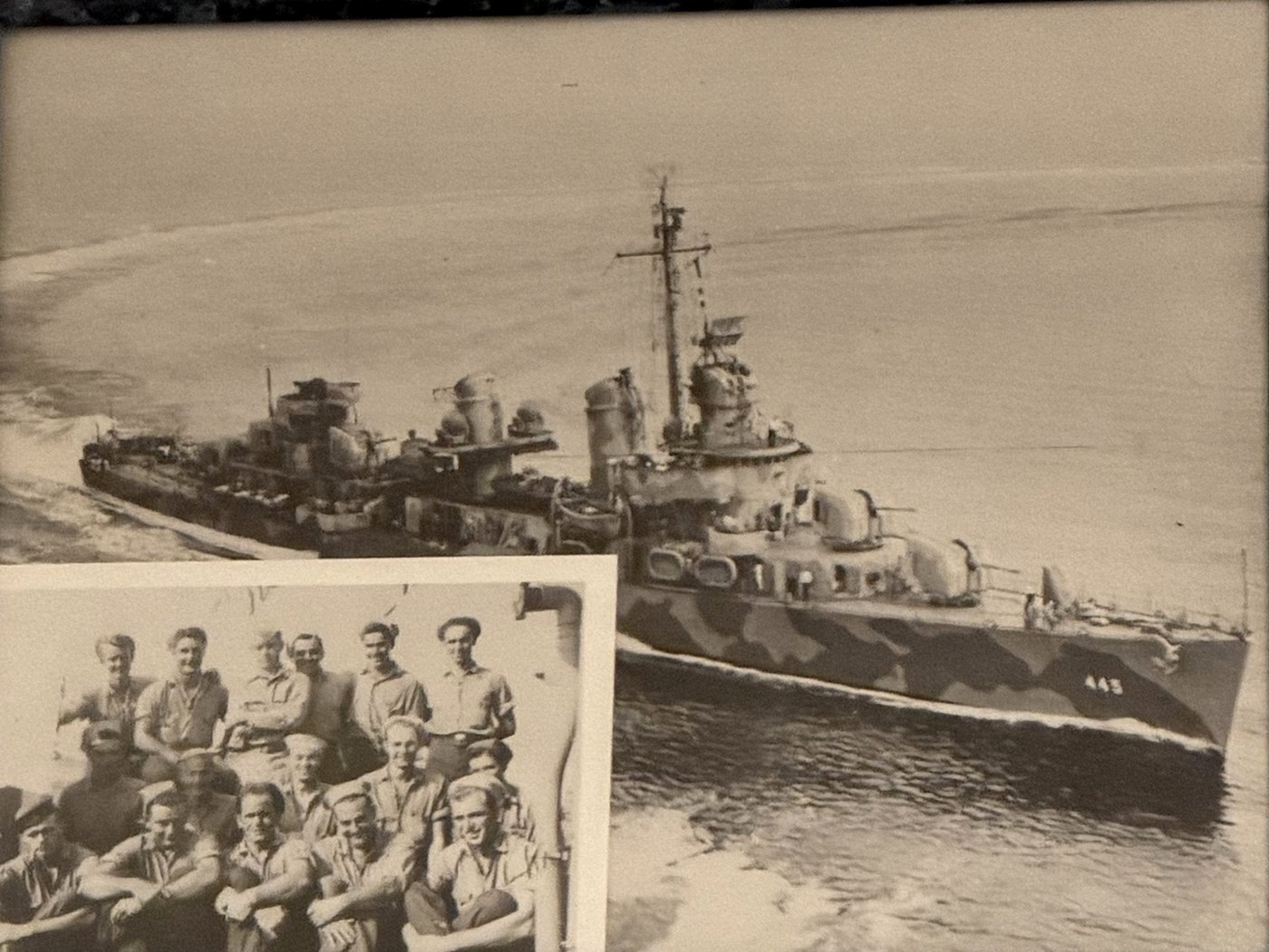 The destroyer USS Fletcher underway in camouflage paint, with an inset photo of the fire control gang